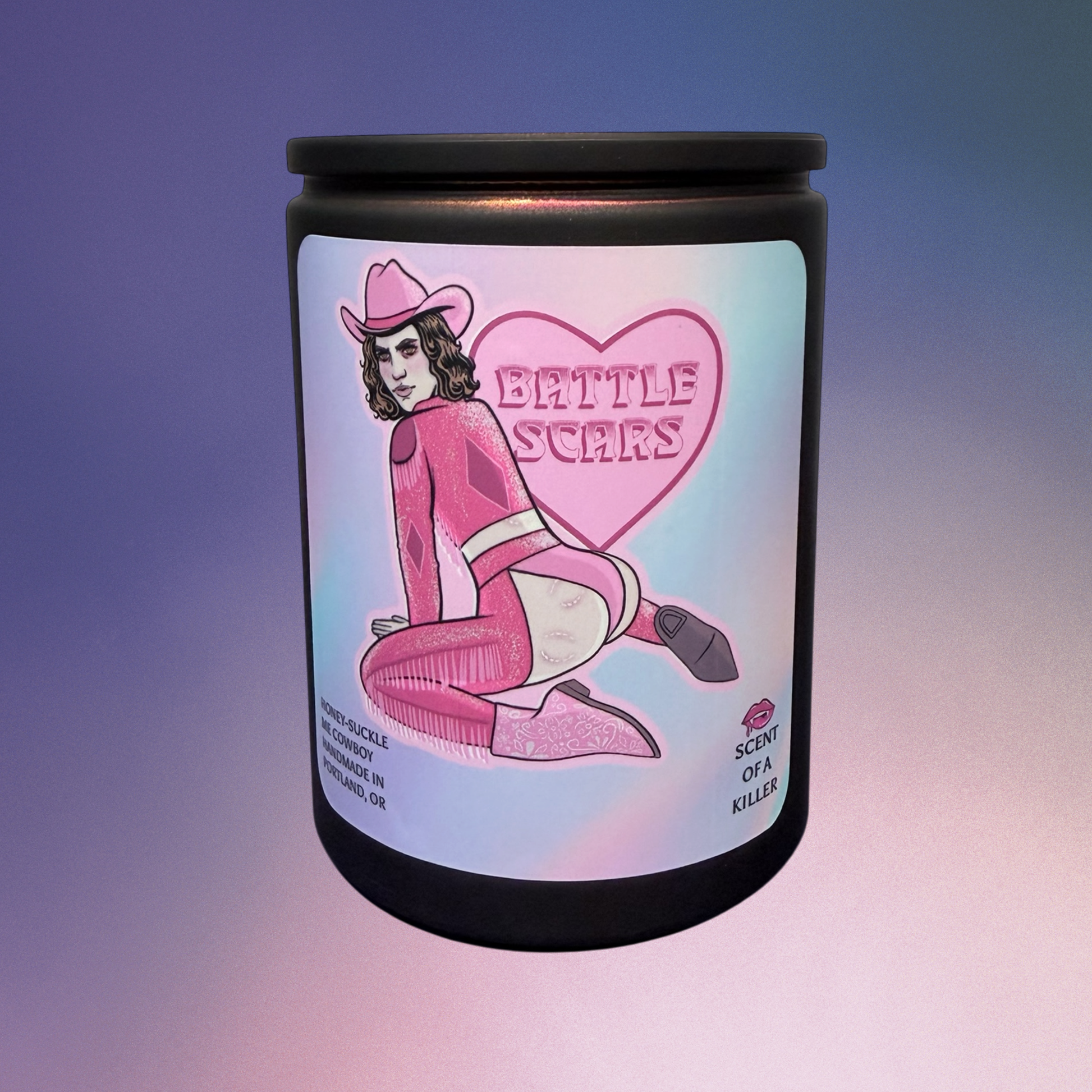 Candle with a label featuring a cowboy in pink attire and 'Battle Scars' text on a gradient background