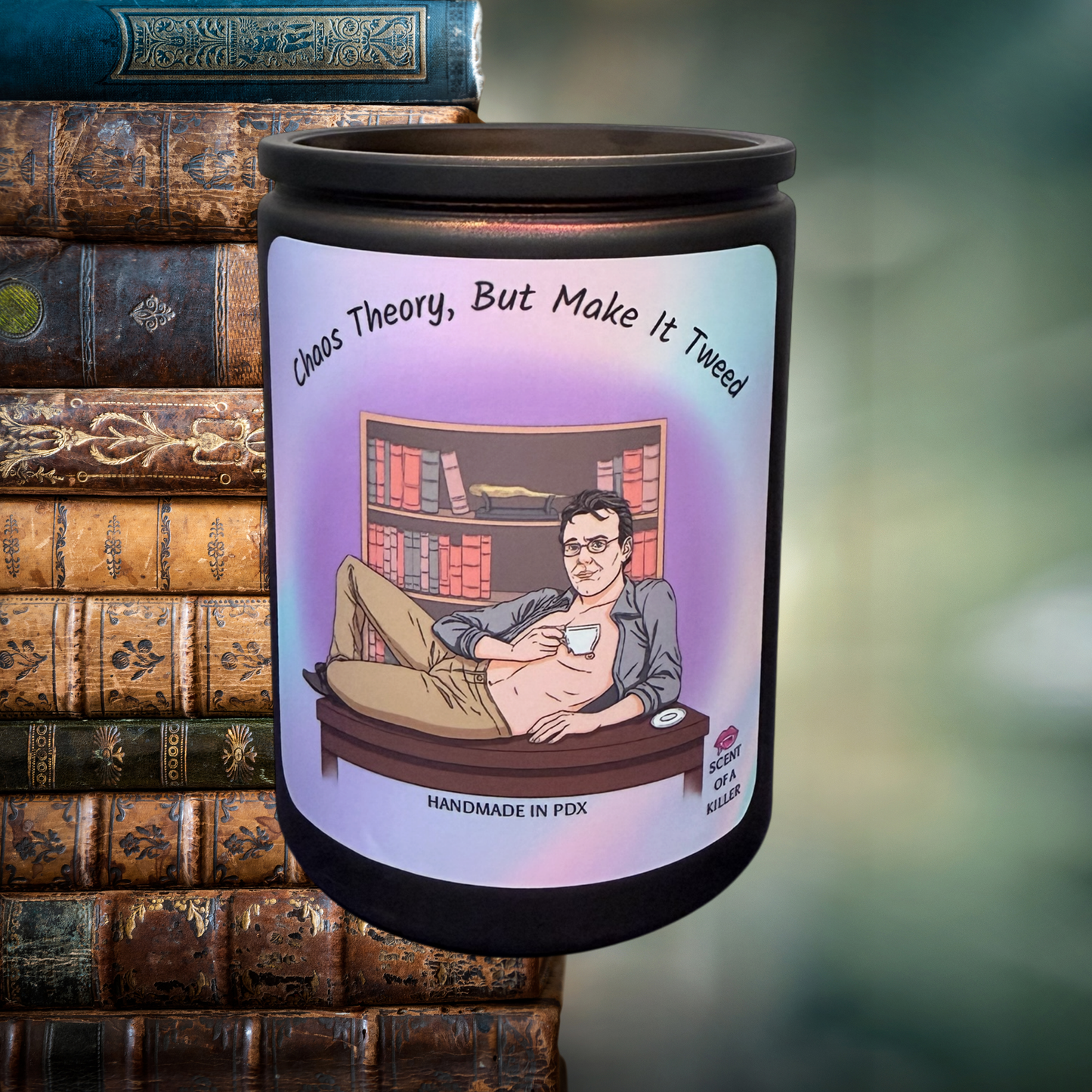 Candle with a printed design of a vampire slayer watcher in a room with books, surrounded by vintage books.